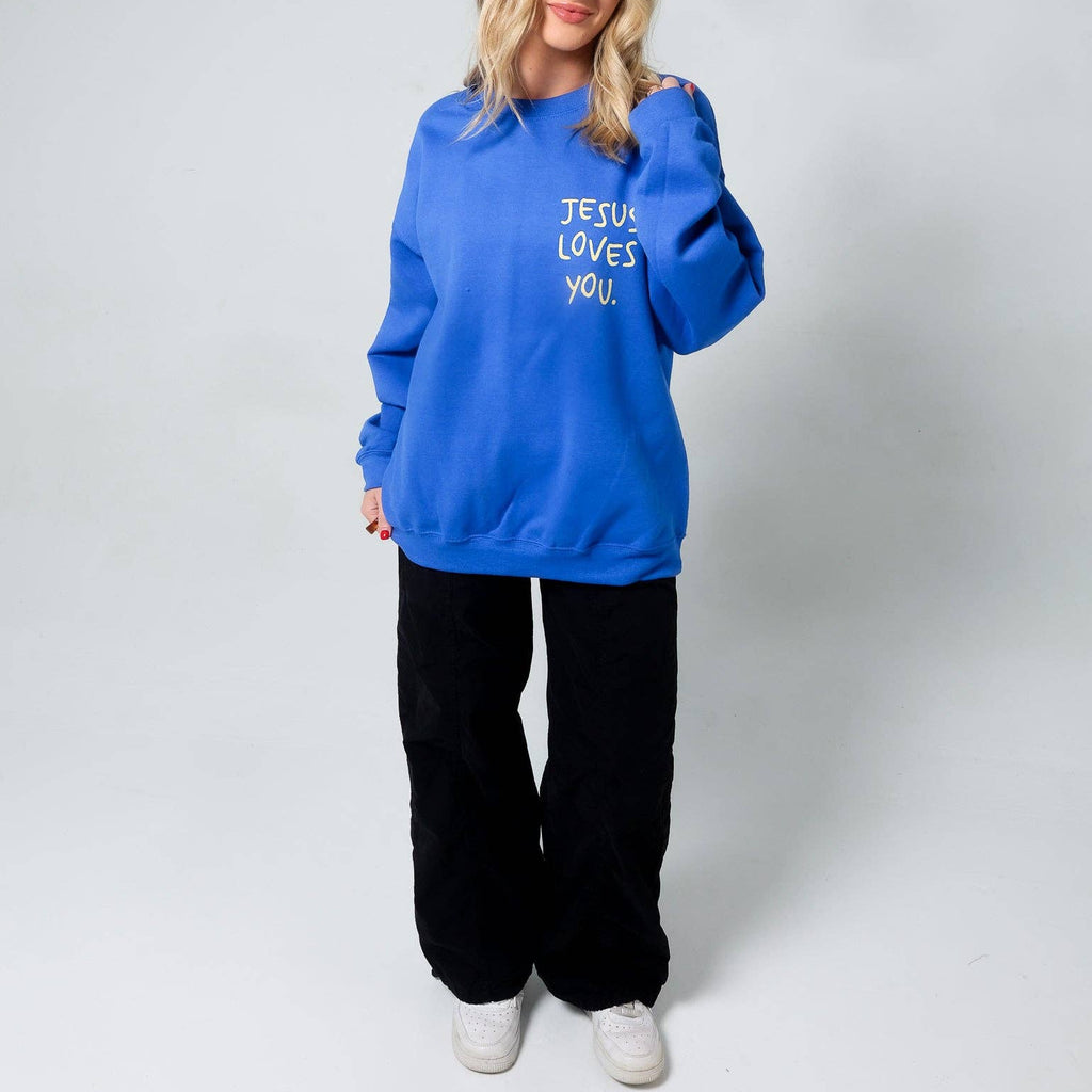 Person wearing a blue hoodie with 'Jesus Loves You' text on a white background