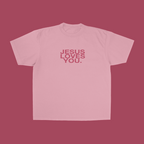 Pink t-shirt with 'Jesus Loves You' text on a pink background